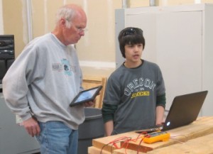 2 people and a laptop