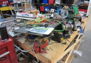 Table with a bunch of parts and tools