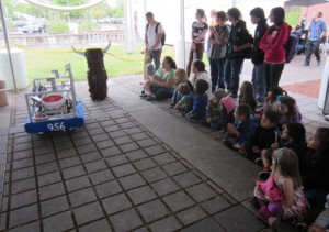 grade schoolers watching robot